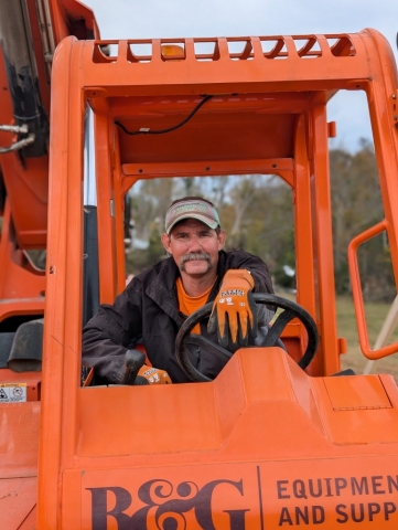 Adam Lazenby taking a break in the excavating machine