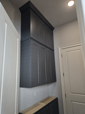Cabinets to ceiling in a laundry room